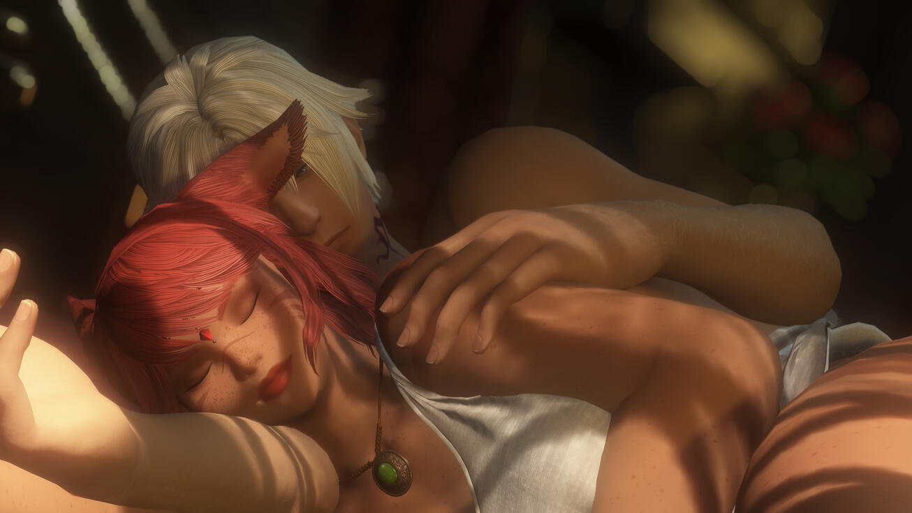 a grey cat lays curled up on a thancred plushie on a pink bedspread.